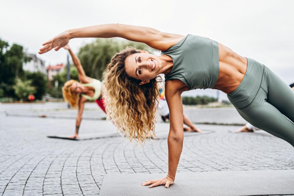a-woman-doing-a-handstand-on-a-yoga-mat | cn-medical-aesthetics-and-wellness